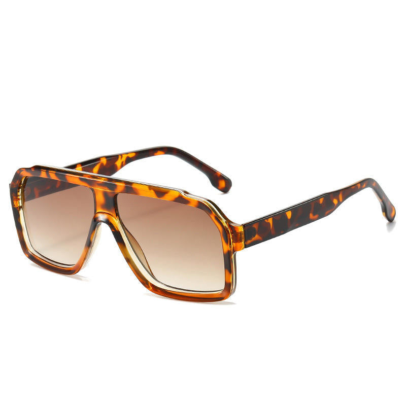 Sunglasses with tortoiseshell frame and brown lenses on a white background