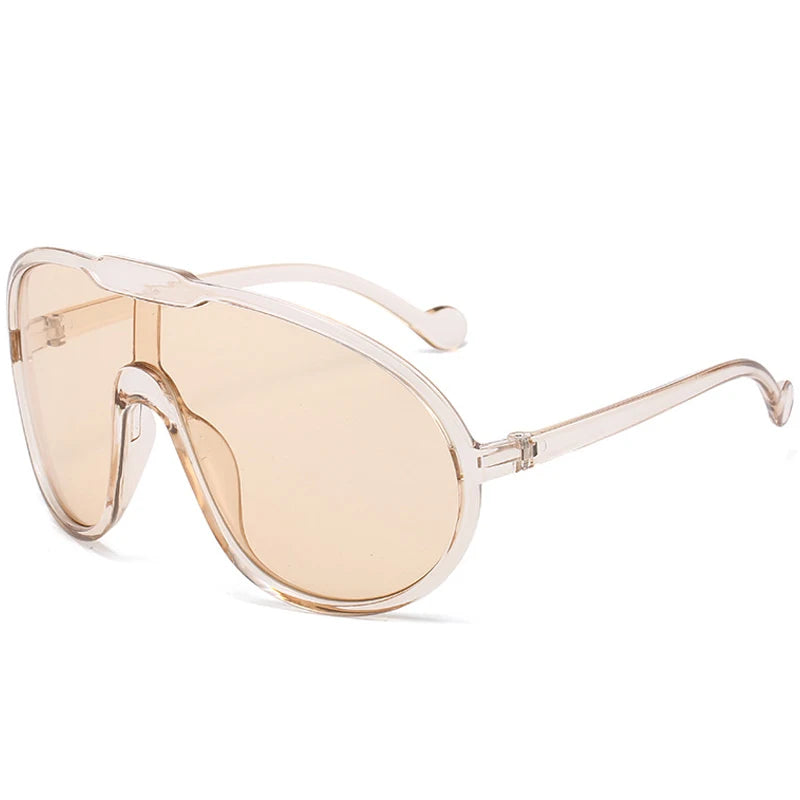 Sunglasses with beige lenses and clear frame on a white background