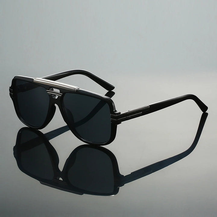 Black sunglasses with reflective surface on a gray background