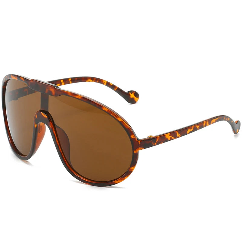 Sunglasses with tortoiseshell frame and brown lenses on a white background