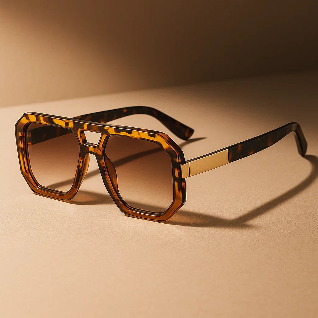 Sunglasses with tortoiseshell frame and brown lenses on a beige background